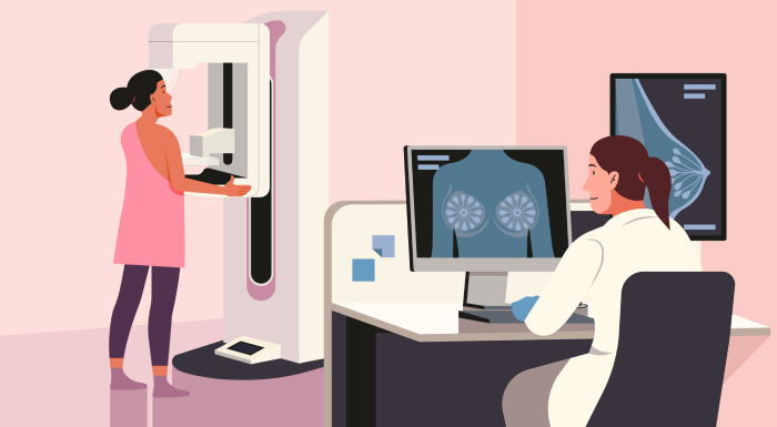 A radiologist reading X-rays of a chest displayed on a monitor in a radiology department