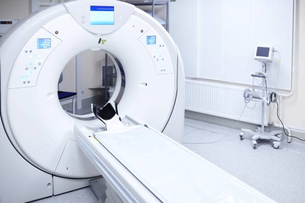 Side view of a CT machine inside a Radiology department. 