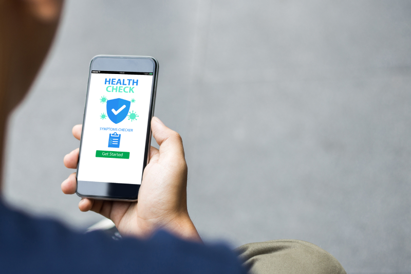 Close up rear view of a man holding a mobile using a health check app.