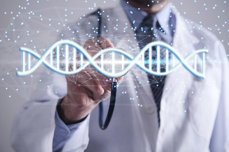 A male doctor holding his stethoscope on a virtual image of a DNA strand shown in front of him.